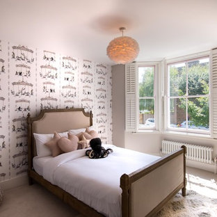 Photo of a medium sized classic children’s room for girls in London with grey walls, carpet and beige floors.