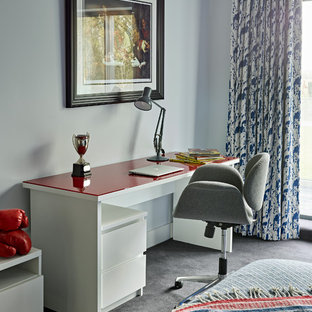 Photo of a contemporary kids' study space in London with grey walls, carpet and grey floors.