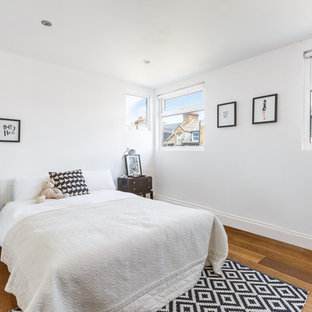 Inspiration for a scandi teen’s room for girls in London with white walls and medium hardwood flooring.
