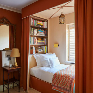 Classic kids' bedroom in London with red walls, carpet and beige floors.