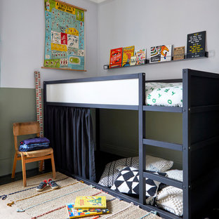 Inspiration for a scandinavian children’s room for boys in London with multi-coloured walls.