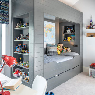 Idee per una cameretta per bambini da 4 a 10 anni contemporanea di medie dimensioni con moquette e pavimento grigio