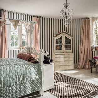 Vintage kids' bedroom for girls in Other with multi-coloured walls, painted wood flooring and white floors.