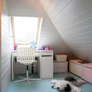 Contemporary kids' bedroom for girls in London with white walls, painted wood flooring and blue floors.