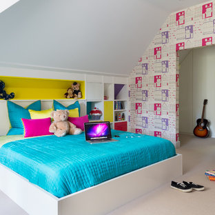Inspiration for a medium sized contemporary children’s room for girls in Other with multi-coloured walls, carpet and beige floors.