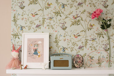 Inspiration for a medium sized traditional children’s room for girls in Surrey with pink walls and carpet.
