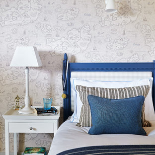 Photo of a coastal children’s room for boys in Wiltshire with beige walls, carpet and beige floors.