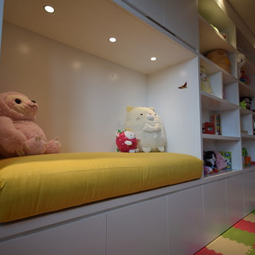 Spacious Kids Playroom With A Built In Seating Area