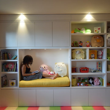 Spacious Kids Playroom With A Built In Seating Area