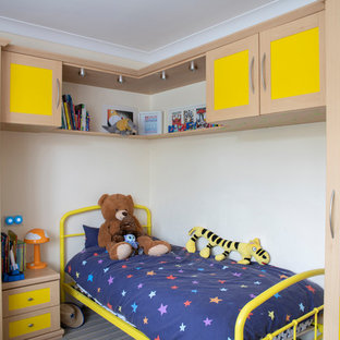 Inspiration for a traditional gender neutral children’s room in Other with white walls.