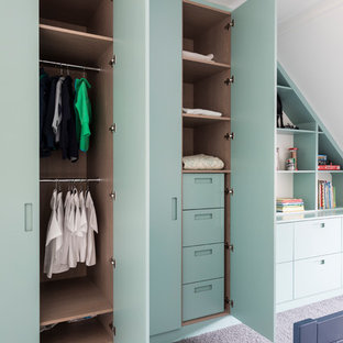 Photo of a contemporary children’s room for boys in London with carpet and grey floors.