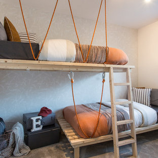Design ideas for a medium sized contemporary gender neutral children’s room in Manchester with white walls, carpet and grey floors.