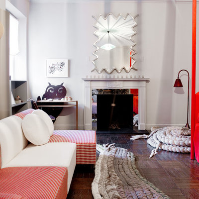 Inspiration for an eclectic gender-neutral dark wood floor playroom remodel in New York with white walls