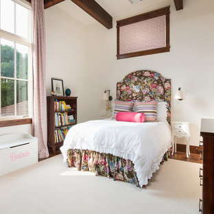 Tuscan medium tone wood floor and brown floor kids' bedroom photo in Austin with white walls