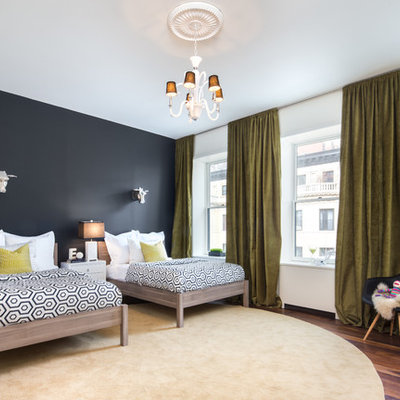 Large trendy gender-neutral medium tone wood floor kids' room photo in New York with multicolored walls