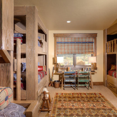 Mountain style gender-neutral carpeted kids' room photo in Denver with beige walls