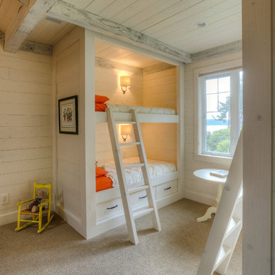 Example of a mountain style gender-neutral carpeted kids' room design in Seattle with white walls