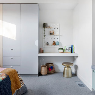 Photo of a large contemporary kids' bedroom in Melbourne with carpet, grey floor and white walls.