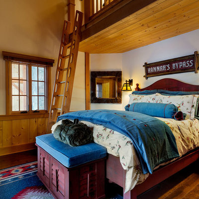 Large mountain style girl medium tone wood floor kids' room photo in Burlington with white walls