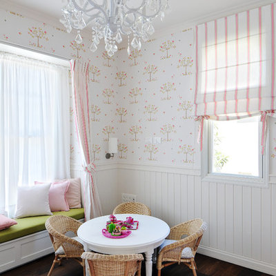 Example of a classic girl dark wood floor kids' room design in Other with white walls