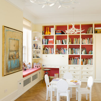 Inspiration for a mid-sized transitional gender-neutral light wood floor kids' room remodel in New York with multicolored walls