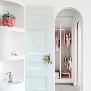 Inspiration for a scandinavian toddler room for girls in Melbourne with white walls, carpet and grey floor.