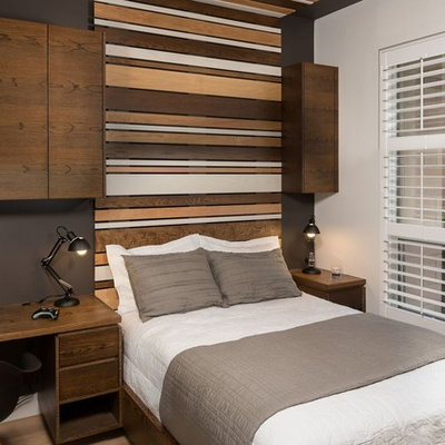 Mid-sized minimalist boy medium tone wood floor and brown floor kids' room photo in Toronto with multicolored walls