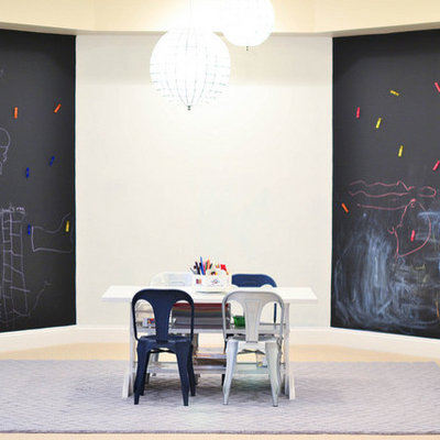 Mid-sized minimalist gender-neutral carpeted kids' room photo in New York with white walls