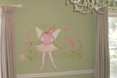 Example of a mid-sized classic girl kids' room design in DC Metro with green walls