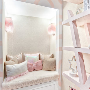 Inspiration for a mid-sized modern girl carpeted and white floor kids' room remodel in New York with pink walls
