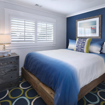 Kids' room - mid-sized coastal gender-neutral light wood floor kids' room idea in San Diego with multicolored walls