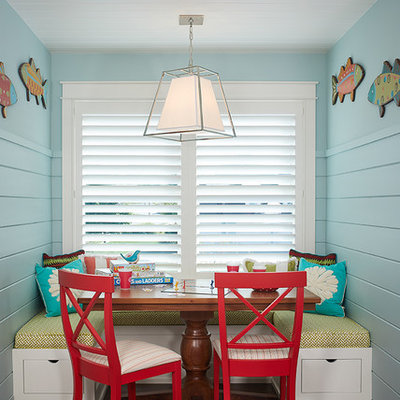 Childrens' room - coastal gender-neutral dark wood floor and brown floor childrens' room idea in Grand Rapids with blue walls