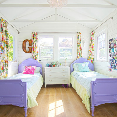 Beach style girl light wood floor kids' room photo in San Francisco with white walls