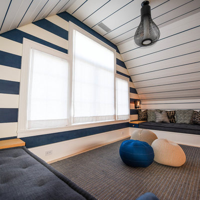 Inspiration for a small coastal gender-neutral gray floor and carpeted kids' room remodel in Other with blue walls