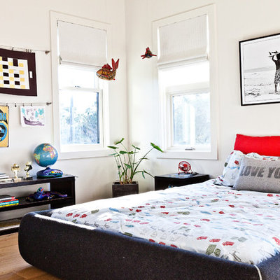 Inspiration for a coastal boy light wood floor kids' room remodel in Charleston with white walls