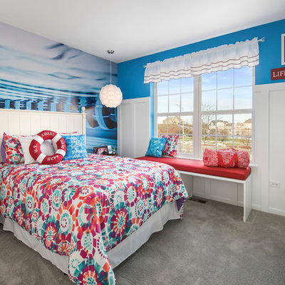Inspiration for a mid-sized eclectic girl carpeted kids' room remodel in Chicago with blue walls