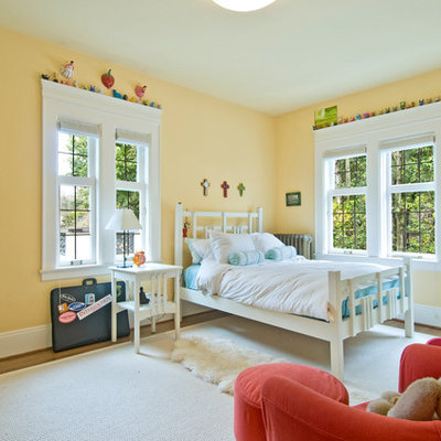 Inspiration for a timeless gender-neutral medium tone wood floor kids' room remodel in Seattle with yellow walls