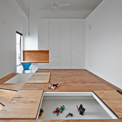 Example of a large trendy boy light wood floor kids' room design in Melbourne with white walls