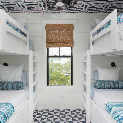 Example of a beach style gender-neutral multicolored floor kids' room design in Other with white walls