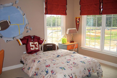 Example of a mid-sized classic boy carpeted kids' room design in DC Metro with beige walls