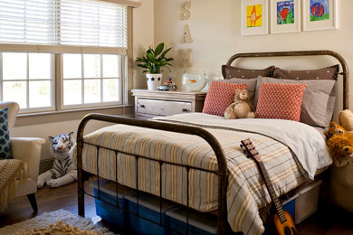 Example of a classic boy dark wood floor kids' room design in Other with beige walls