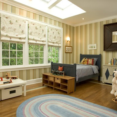 Inspiration for a timeless gender-neutral medium tone wood floor kids' room remodel in New York with multicolored walls