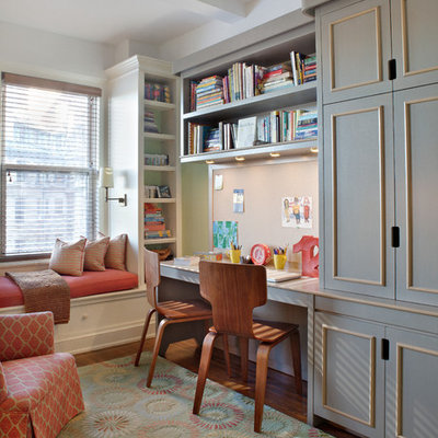 Inspiration for a mid-sized timeless gender-neutral medium tone wood floor kids' room remodel in New York with beige walls