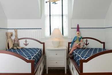 Mid-sized beach style boy dark wood floor and brown floor kids' room photo in Boston with white walls