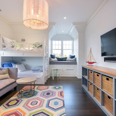 Kids' bedroom - transitional gender-neutral dark wood floor and brown floor kids' bedroom idea in New York with white walls