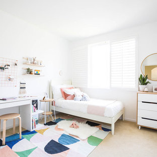 Kids' room - small modern girl carpeted and beige floor kids' room idea in San Francisco with white walls