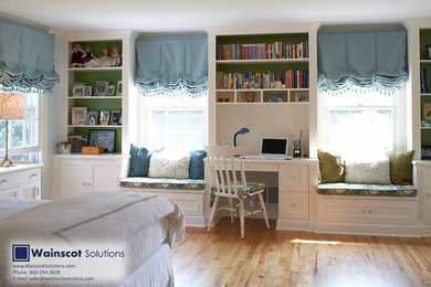Design ideas for a medium sized contemporary gender neutral teen’s room in New York with blue walls and light hardwood flooring.