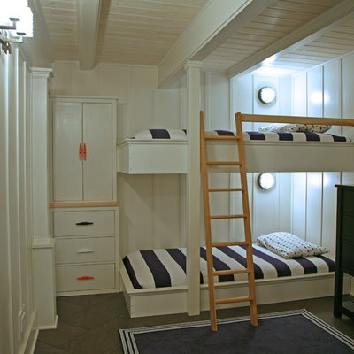 Beach style gender-neutral kids' room photo in Milwaukee with white walls