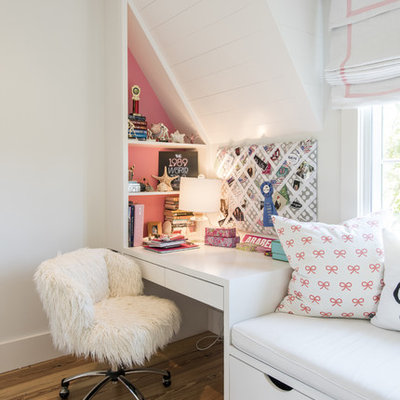 Transitional girl medium tone wood floor kids' room photo in Louisville with pink walls