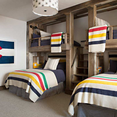 Example of a mountain style gender-neutral carpeted kids' room design in Birmingham with white walls